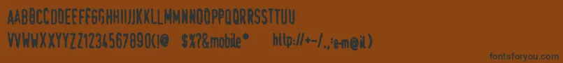 Шрифт SwedeTrauma – чёрные шрифты на коричневом фоне