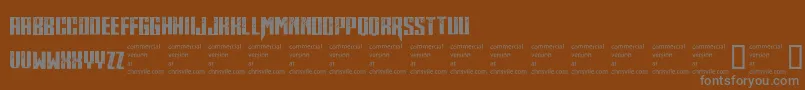 Midnitehour-fontti – harmaat kirjasimet ruskealla taustalla