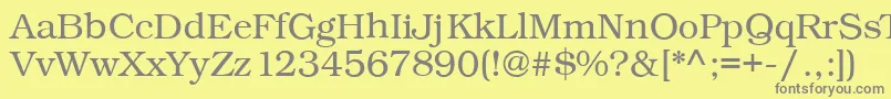Fonte Kacstonefixed – fontes cinzas em um fundo amarelo