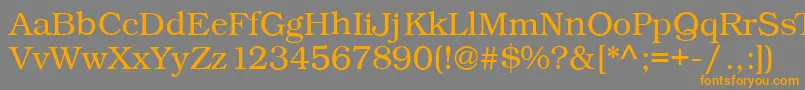 フォントKacstonefixed – オレンジの文字は灰色の背景にあります。