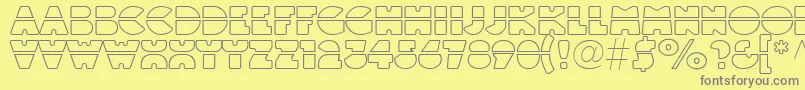 フォントLinotypeblackwhiteoutlinelaser – 黄色の背景に灰色の文字