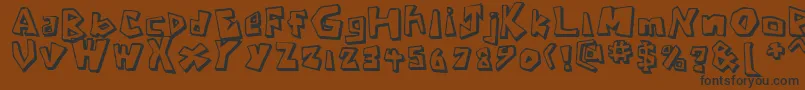 CavemanRegular-fontti – mustat fontit ruskealla taustalla