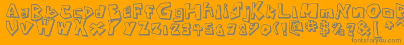 CavemanRegular-Schriftart – Graue Schriften auf orangefarbenem Hintergrund