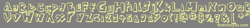 CavemanRegular-Schriftart – Gelbe Schriften auf grauem Hintergrund