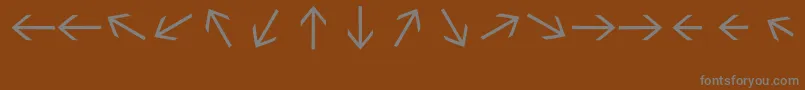 Weitere Informationen zur Sebastianarrrowstexttext-Schriftart Sebastianarrrowstexttext-Schriftart – Graue Schriften auf braunem Hintergrund