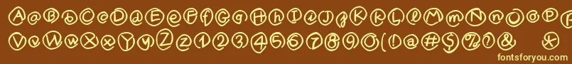 MklammeraffenMedium-fontti – keltaiset fontit ruskealla taustalla