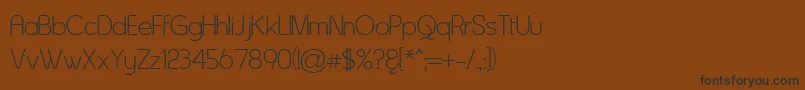 Asenine Font – Black Fonts on Brown Background