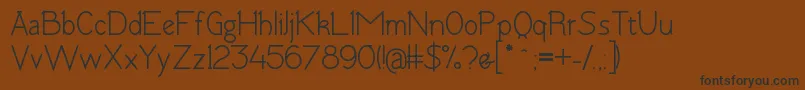 TomskBold Font – Black Fonts on Brown Background