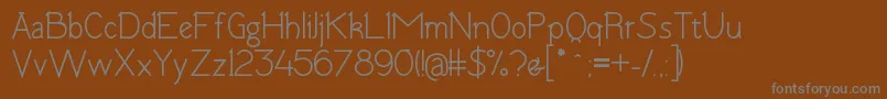 TomskBold Font – Gray Fonts on Brown Background