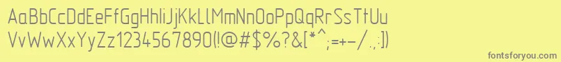 フォントMipgost – 黄色の背景に灰色の文字