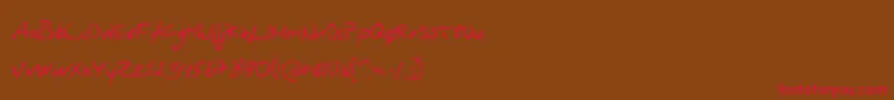 フォントAsphyxiateAsphyxiateRegular – 赤い文字が茶色の背景にあります。
