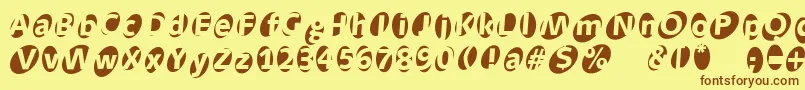 Fonte Aidaoops – fontes marrons em um fundo amarelo