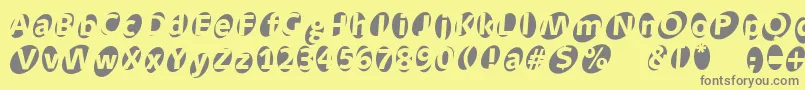 Aidaoops Font – Gray Fonts on Yellow Background