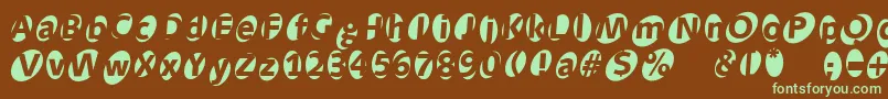 フォントAidaoops – 緑色の文字が茶色の背景にあります。