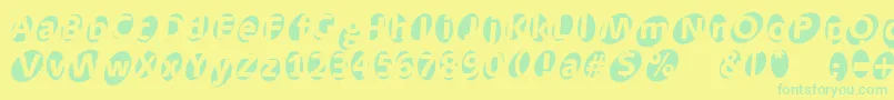 Aidaoops Font – Green Fonts on Yellow Background