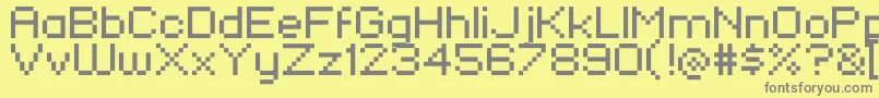 KlmnFlashPix-fontti – harmaat kirjasimet keltaisella taustalla