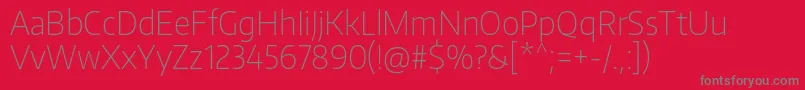 フォントEncodesansnarrowThin – 赤い背景に灰色の文字