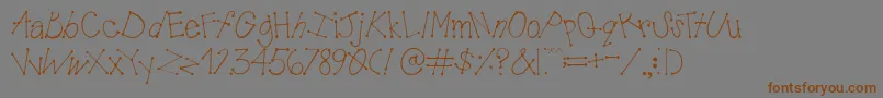 フォントAustieBostMudPies – 茶色の文字が灰色の背景にあります。