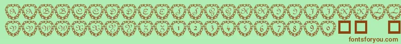 Fonte 101heartframed – fontes marrons em um fundo verde