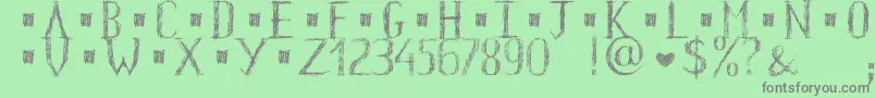 HkhOldGlyphsShort Font – Gray Fonts on Green Background