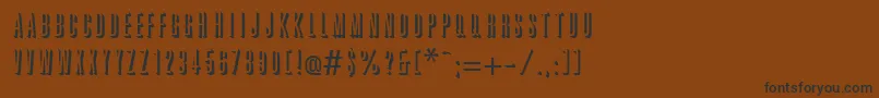 フォントGreatRelief – 黒い文字が茶色の背景にあります