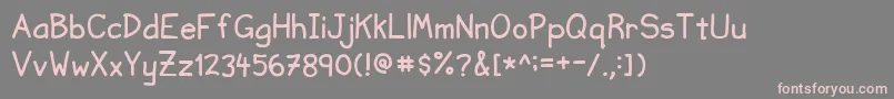 フォントNvscriptUc – 灰色の背景にピンクのフォント