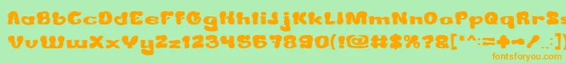 CreamyButter-Schriftart – Orangefarbene Schriften auf grünem Hintergrund