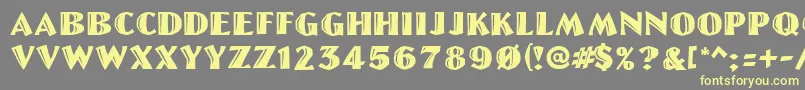 Linolettercut Font – Yellow Fonts on Gray Background