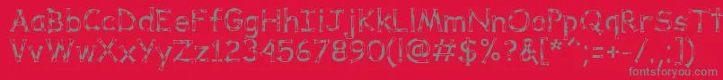DalmataDreamRegular-Schriftart – Graue Schriften auf rotem Hintergrund