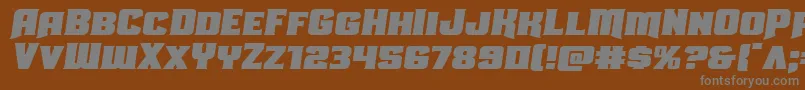 Uniongrayexpandsemital-fontti – harmaat kirjasimet ruskealla taustalla