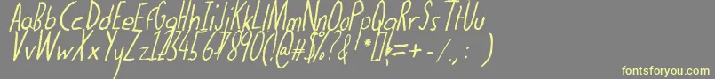 Thedogatemyhomeworkital-Schriftart – Gelbe Schriften auf grauem Hintergrund