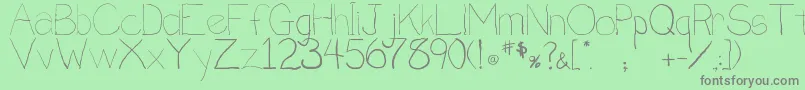 Penmanship.B Font – Gray Fonts on Green Background