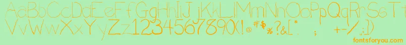 フォントPenmanship.B – オレンジの文字が緑の背景にあります。