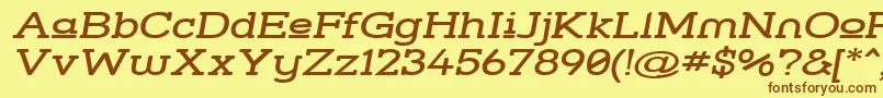 フォントStrsluwi – 茶色の文字が黄色の背景にあります。