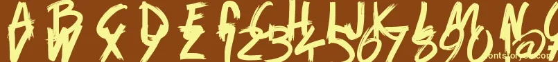 Шрифт GameOfBrush – жёлтые шрифты на коричневом фоне