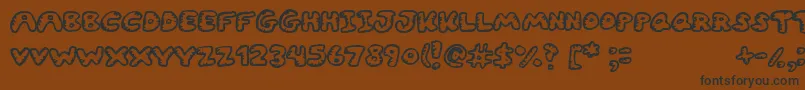 Gwibble Font – Black Fonts on Brown Background