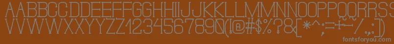 DonMoiseSt-fontti – harmaat kirjasimet ruskealla taustalla