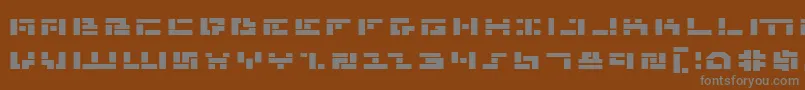 Mmanbe-fontti – harmaat kirjasimet ruskealla taustalla