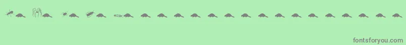 Animals2-Schriftart – Graue Schriften auf grünem Hintergrund