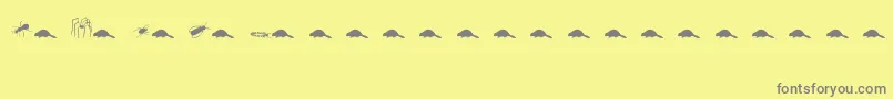 Fonte Animals2 – fontes cinzas em um fundo amarelo