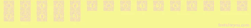 Schmuckinitialen3-fontti – vaaleanpunaiset fontit keltaisella taustalla