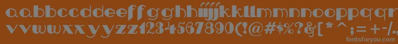 フォントNipandtuck – 茶色の背景に灰色の文字