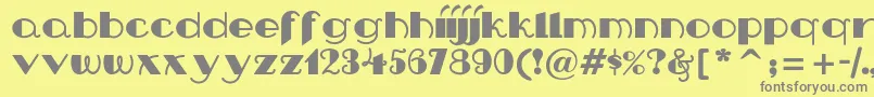 Nipandtuck Font – Gray Fonts on Yellow Background