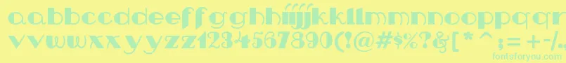 Nipandtuck Font – Green Fonts on Yellow Background