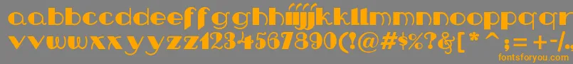 Nipandtuck Font – Orange Fonts on Gray Background