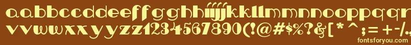 Nipandtuck Font – Yellow Fonts on Brown Background