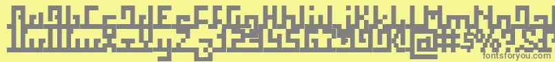Squab-fontti – harmaat kirjasimet keltaisella taustalla