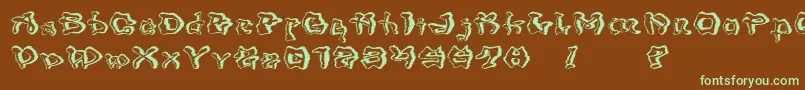 フォントMondrongoTrash – 緑色の文字が茶色の背景にあります。