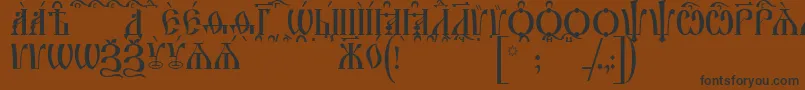 IrmologionCapsKucs Font – Black Fonts on Brown Background