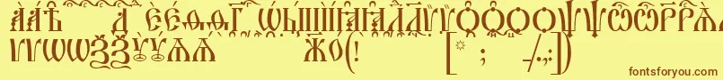 フォントIrmologionCapsKucs – 茶色の文字が黄色の背景にあります。